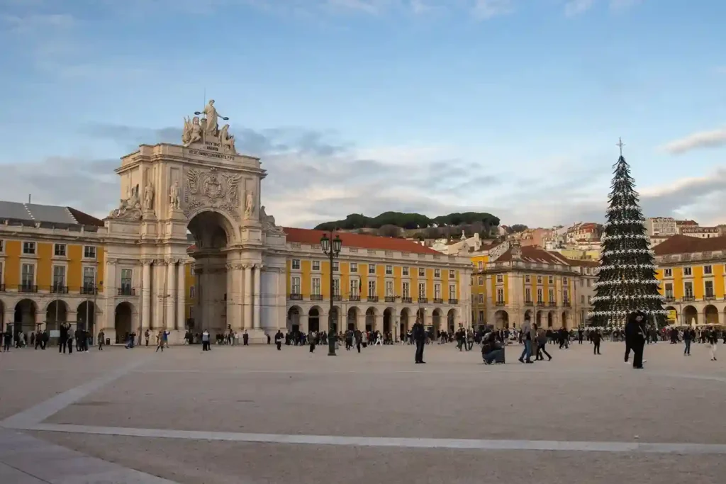 Portugal weather in December with a solo traveler walking through rainy Lisbon streets